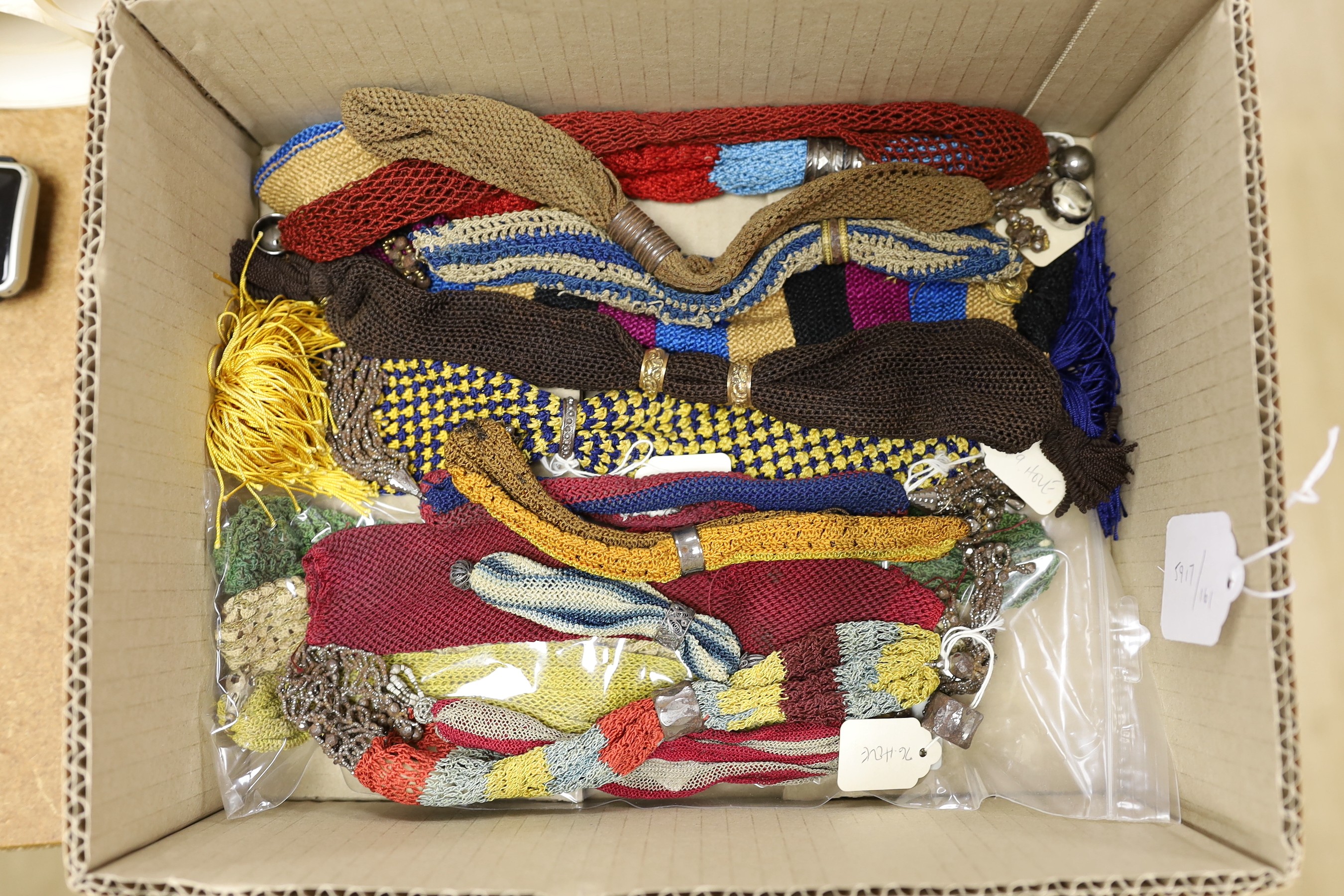 Twenty four mixed 19th century knitted misers purses and one knitted novelty ‘sock’ misers purse